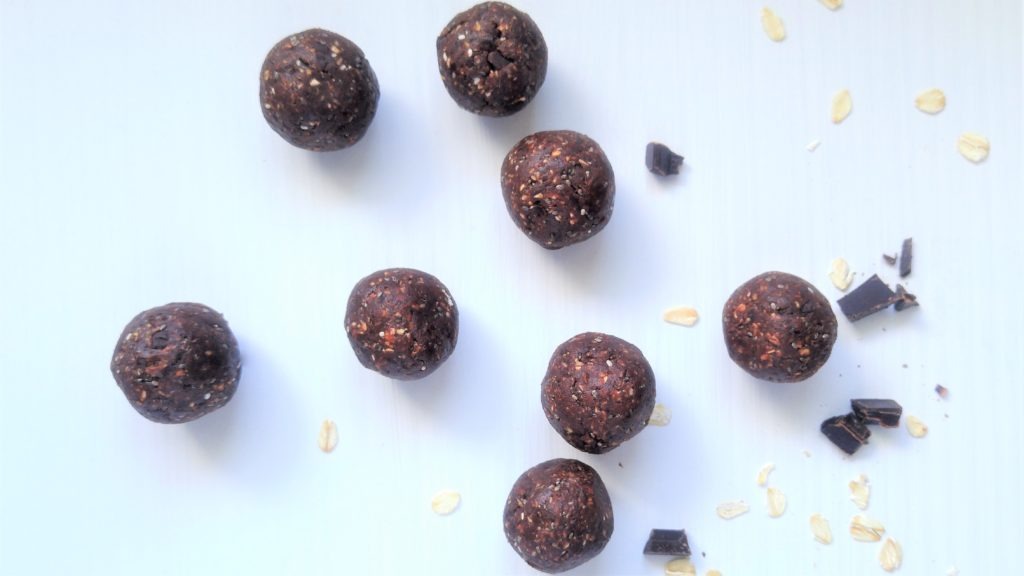 Double chocolate energy balls on a white table