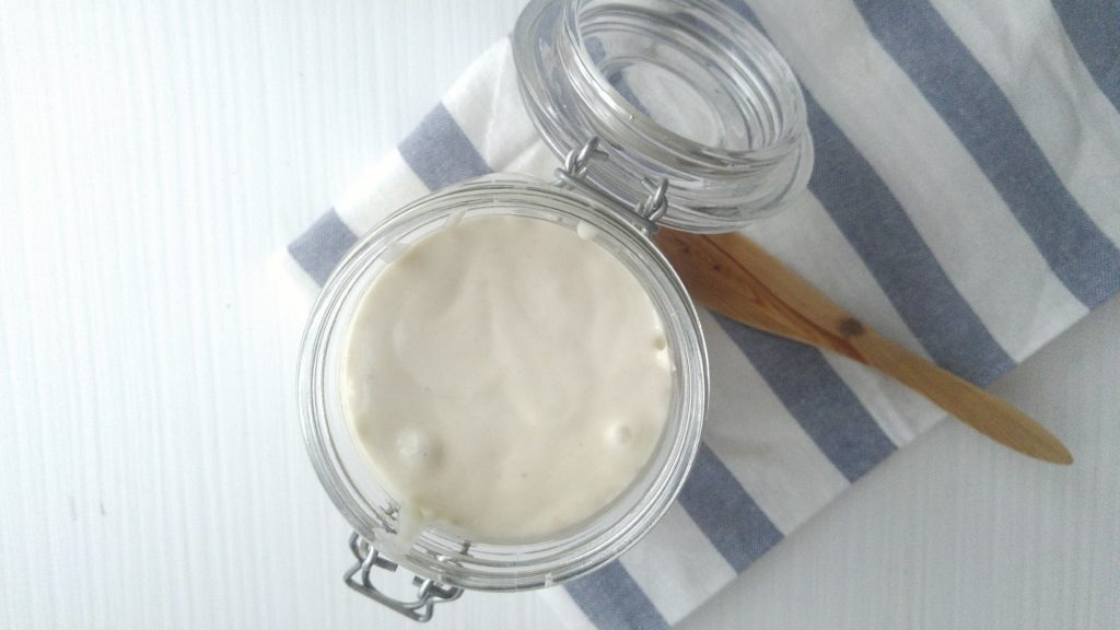 top view of open jar filled with bubbling sourdough starter