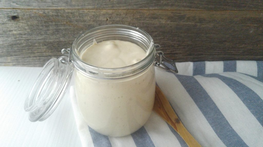 sourdough starter bubbling in a jar