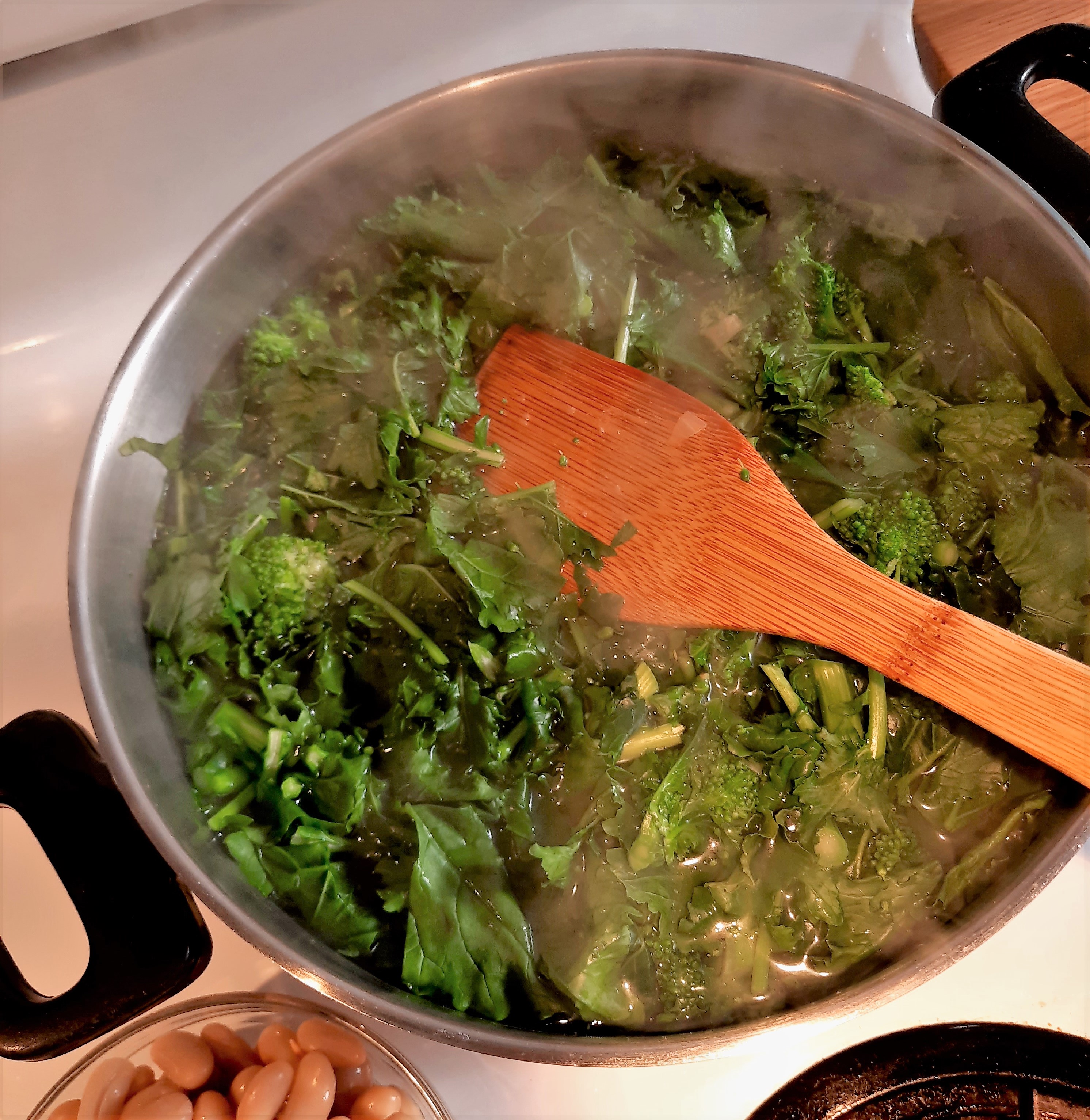 rapini in a pot of boiling water
