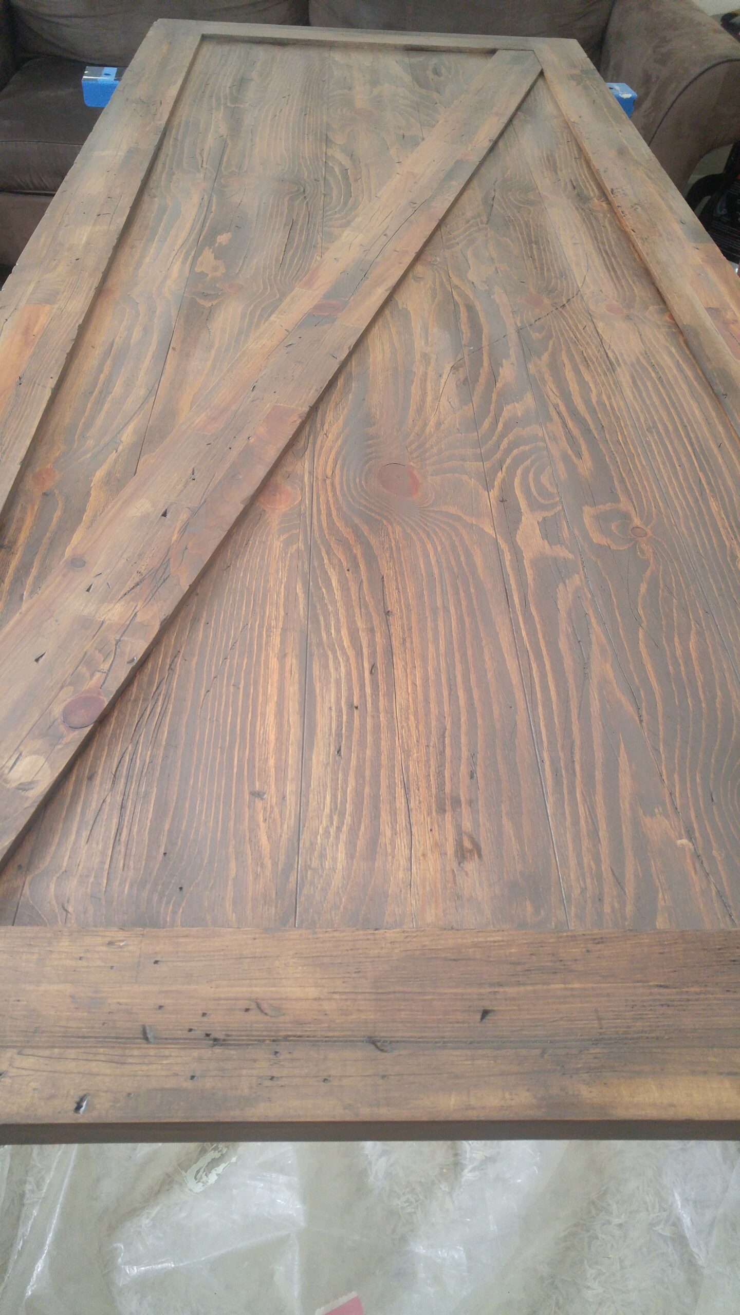rustic stain on barn door lying on saw horses