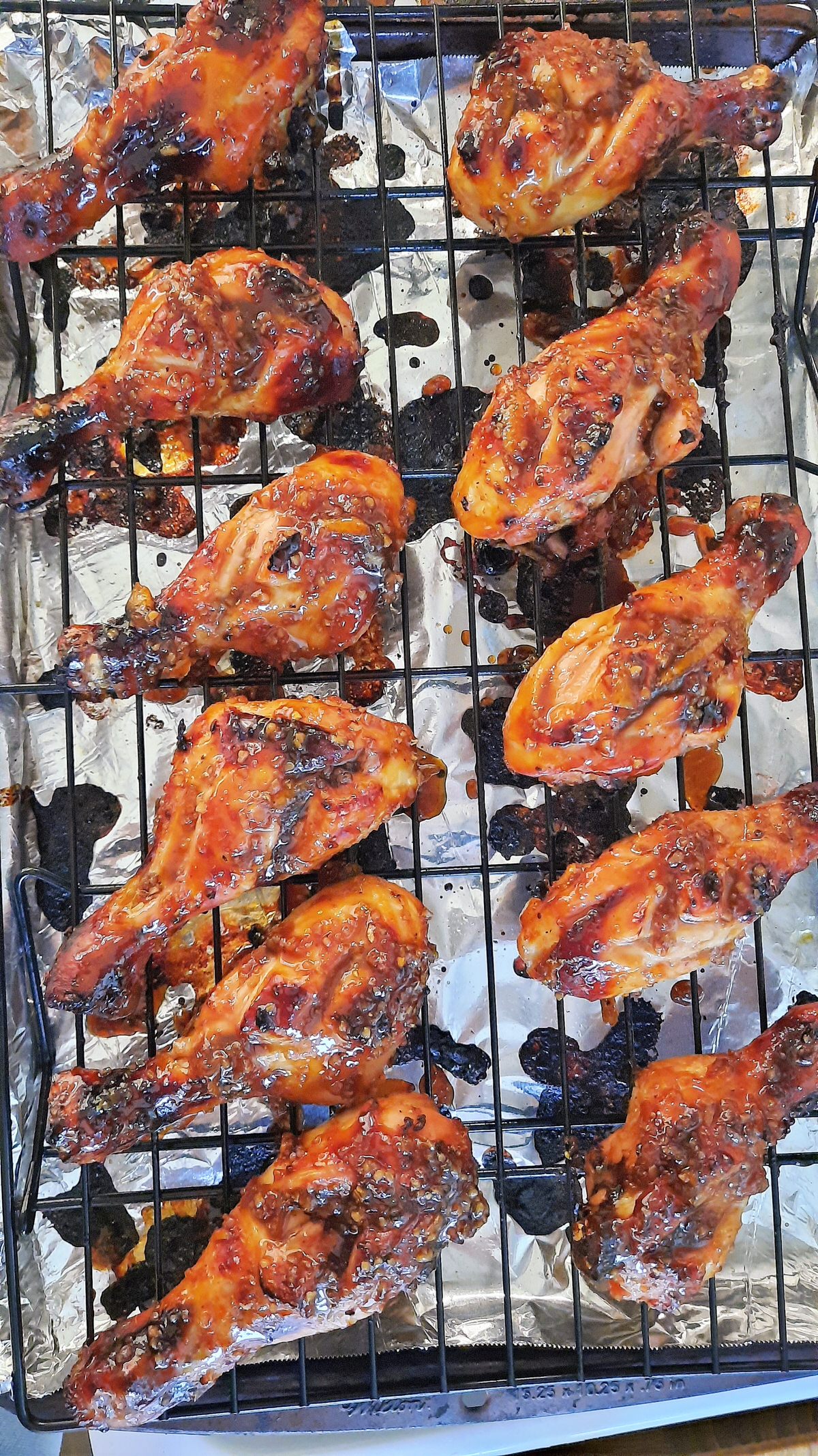 sticky and sweet drumsticks cooked resting on a wire rack