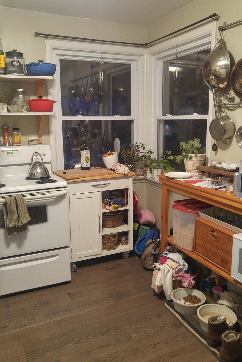 messy small kitchen cart serves as an entire counter