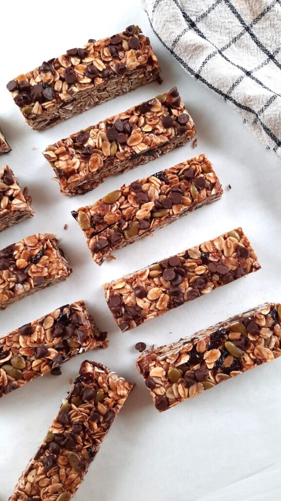 rows of homemade granola bars on a white counter