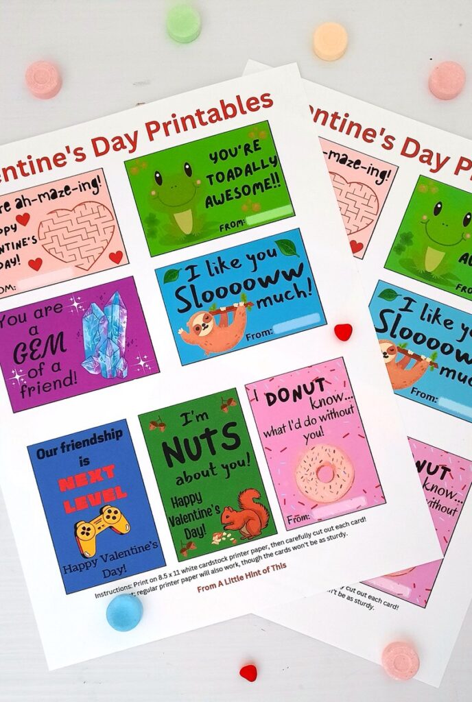 valentine's day card printables on a table surrounded by little candies