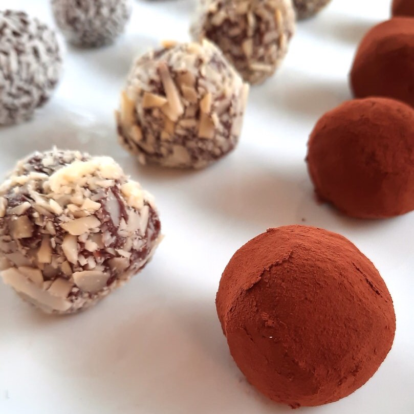chocolate truffles on a white plate