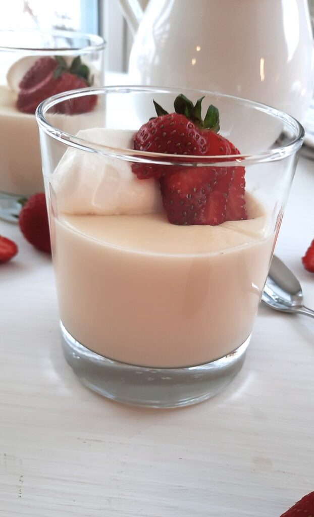 side view of a glass of homemade vanilla pudding