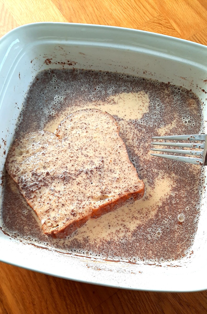 bread soaking in french toast mixture