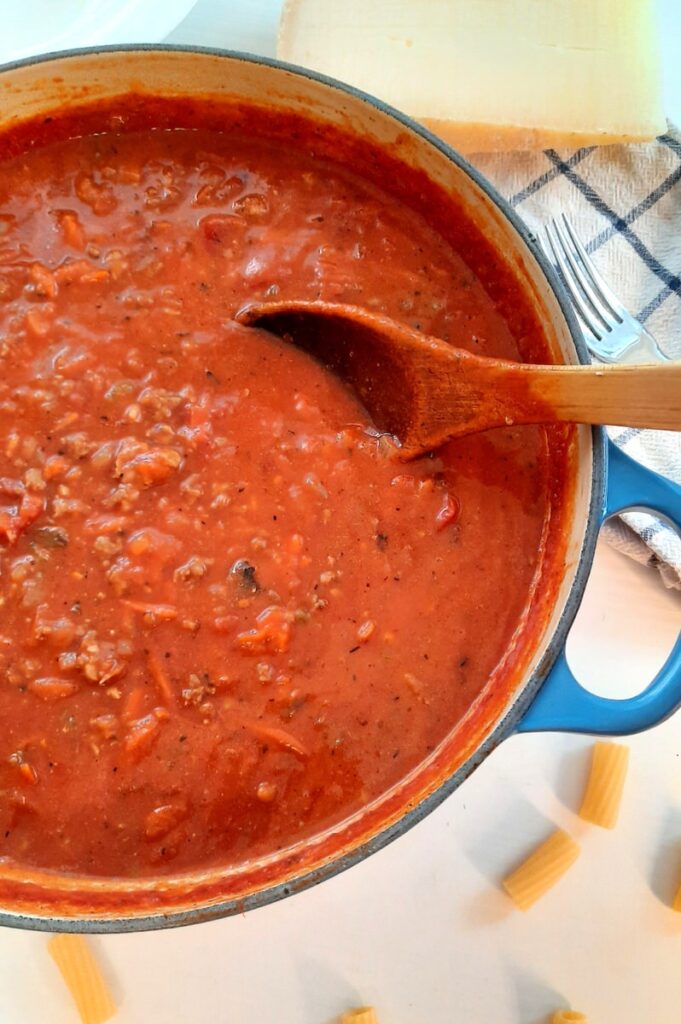 easy homemade pasta sauce in a blue pot on a white counter