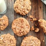 large salted caramel oatmeal cookies on a rustic cutting board