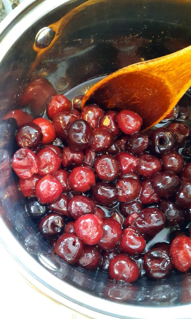 cherries cooking in a saucepan