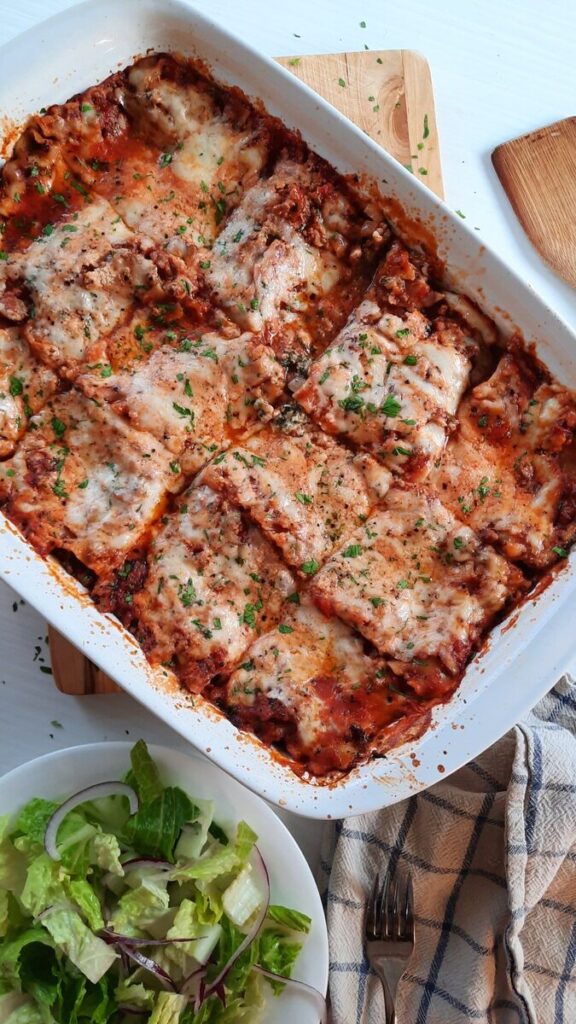 a dish of bubbly hot cheesy homemade lasagna