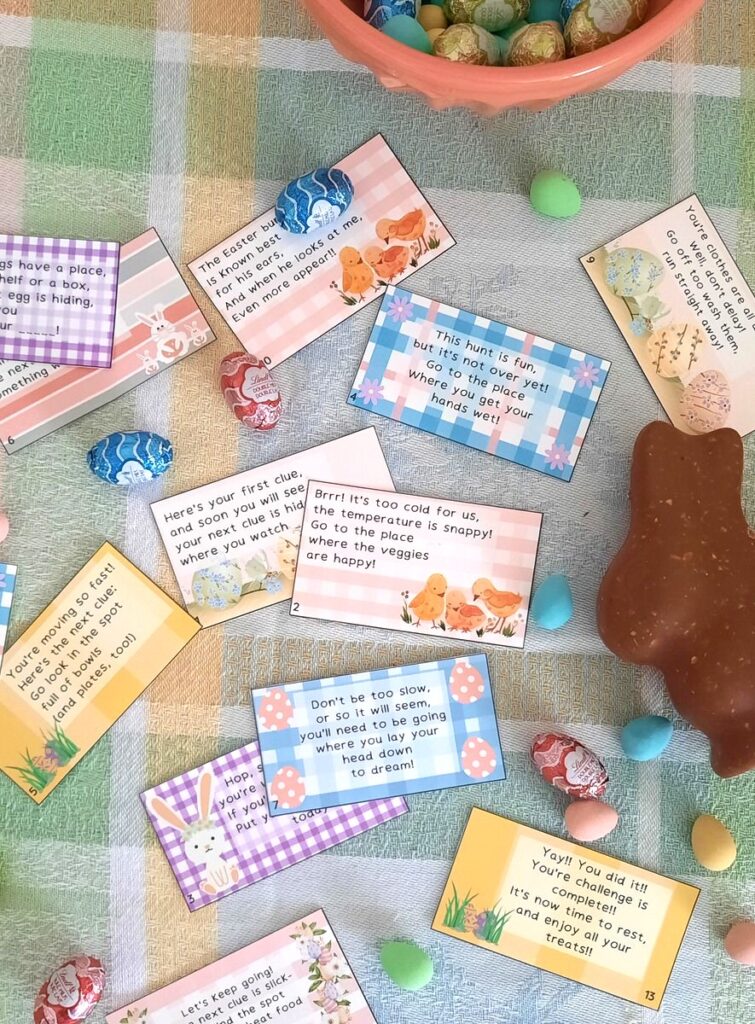 Easter egg hunt clues on a table with a chocolate bunny and chocolate mini eggs